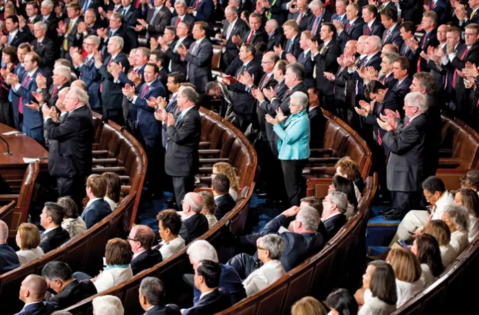 Democrats stay seated as Republicans give a standing ovation during President Donald Trump’s address to a joint session of Congress, Feb. 28, 2017. (Bill Clark / CQ Roll Call / Getty)