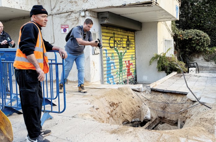 A crater in Tel Aviv formed by an Iranian missile strike, March 8, 2026.