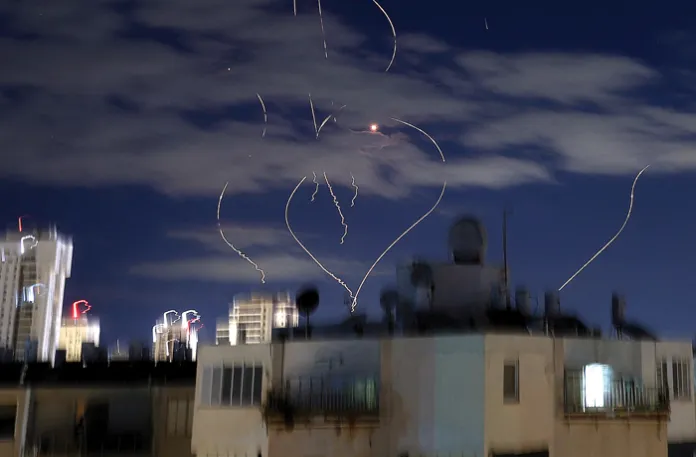 Rocket trails above the Israeli coastal city of Netanya, March 9, 2026. (Jack Guez/AFP/Getty)