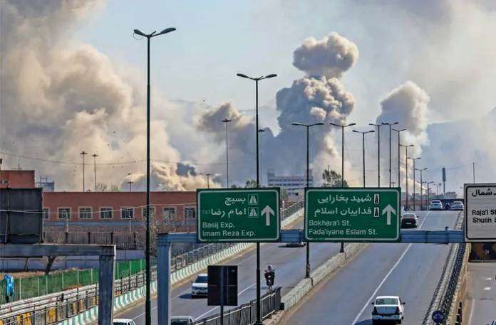Large plumes of smoke rise over Tehran on the sixth day of bombing by the U.S. and Israel, March 5, 2026 (Atta Kenare/AFP/Getty)