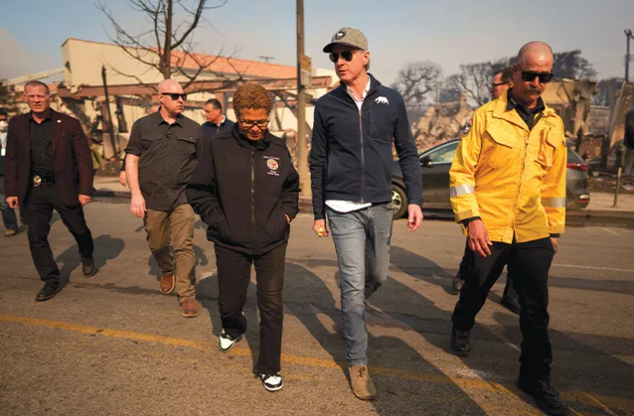 Gov. Gavin Newsom (D-CA) and Los Angeles Mayor Karen Bass tour the downtown business district of Pacific Palisades on Jan. 8, 2025, in Los Angeles. (Eric Thayer/Getty Images)