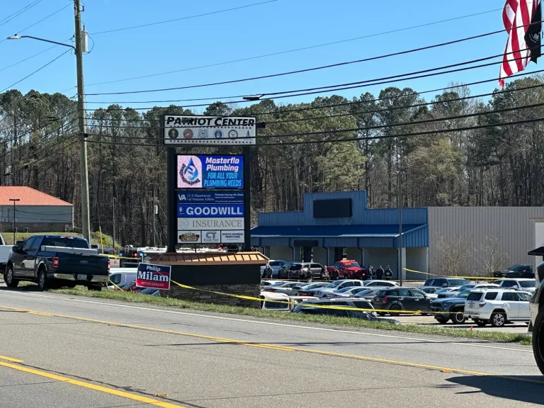 Emergency vehicles are seen outside a Department of Veterans Affairs clinic in Jasper, Ga., Tuesday, March 17, 2026. (AP Photo/Emilie Megnien)