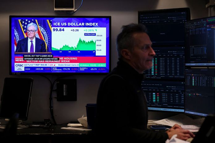 A livestream shows Jerome Powell, chairman of the US Federal Reserve, speaking after a Federal Open Market Committee (FOMC) meeting on the floor of the New York Stock Exchange (NYSE) in New York on March 18, 2026. The US Federal Reserve kept interest rates unchanged Wednesday as expected, in defiance of President Donald Trump as the world's largest economy battles stubborn inflation, weak labor demand and an "uncertain" economic outlook due to the war in Iran. The Fed's 11-1 vote kept rates steady at a range between 3.50 percent and 3.75 percent, with officials flagging one expected rate cut by the end of the year. (Photo by ANGELA WEISS / AFP via Getty Images)