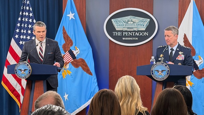 Defense Secretary Pete Hegseth and Chairman of the Joint Chiefs of Staff Gen. Dan Caine, speak during a press briefing at the Pentagon, Wednesday, March 4, 2026, in Washington. (AP Photo/Konstantin Toropin)