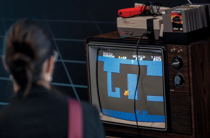 A person plays Super Mario Bros. at the Montreal International Gaming Summit in Quebec in 2025. (Andrej Ivanov/AFP via Getty Images)