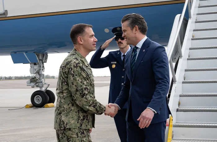Adm. Brad Cooper, leader of U.S. Central Command, greeted War Secretary Pete Hegseth at MacDill Air Force Base in Florida on March 5. (Newscom)