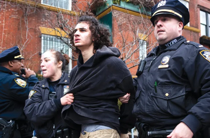 Police detain Emir Balat after he attempted to detonate an improvised explosive device outside Gracie Mansion on March 7 in New York. (Julius Constantine Motal/AP)