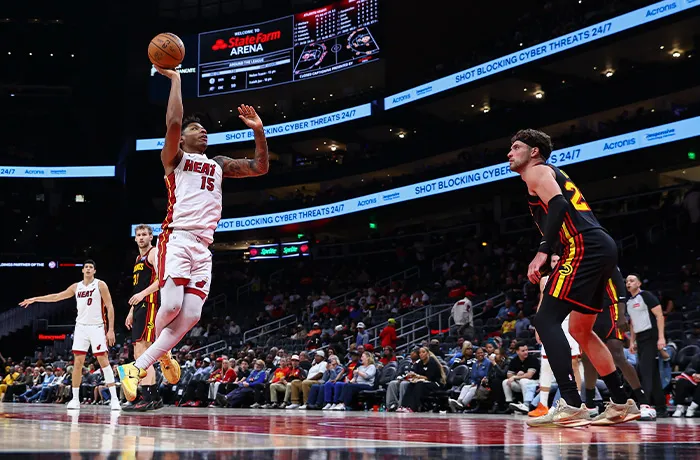 Miami Heat forward Myron Gardner (15) shoots against Atlanta Hawks forward Corey Kispert, right, during the second half of an NBA basketball game on Feb. 20, 2026, in Atlanta. (Colin Hubbard/AP)