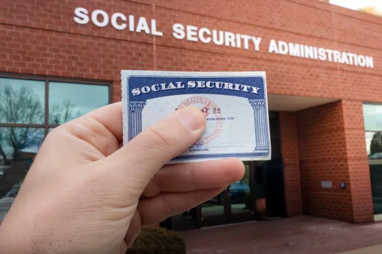 Social security money card while waiting in line for benefits at the Social Security Administration.
