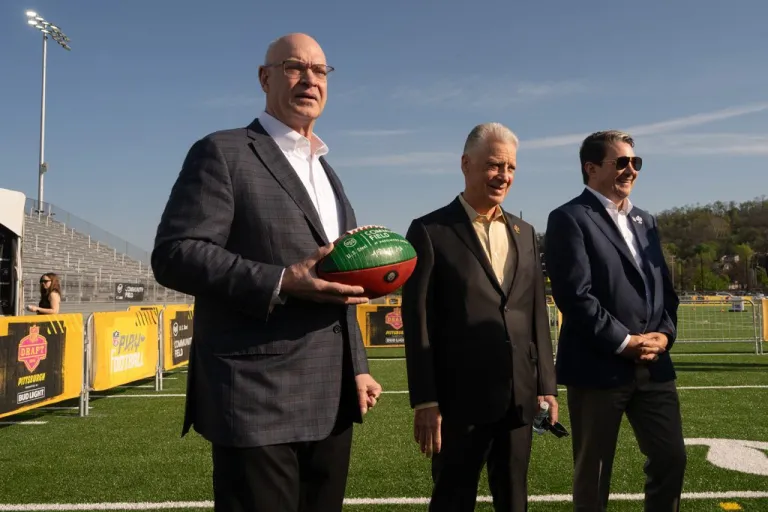 President and CEO of U.S. Steel David Burritt, left, stands with President of the Pittsburgh Steelers Art Rooney II, center, after a ceremony to open the U.S. Steel Community Field at Hazelwood Green on Wednesday, April 22, 2026.