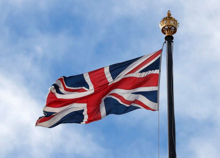 A Union Jack flies on a flag pole