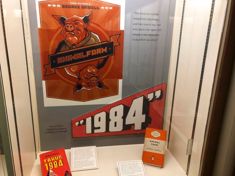 In this Oct. 21, 2019, photo, a poster promoting George Orwell's novels 