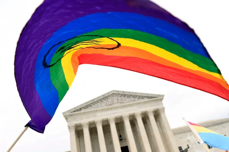 In this Oct. 8, 2019, file photo, people gather outside the Supreme Court in Washington. (AP Photo/Susan Walsh, File)