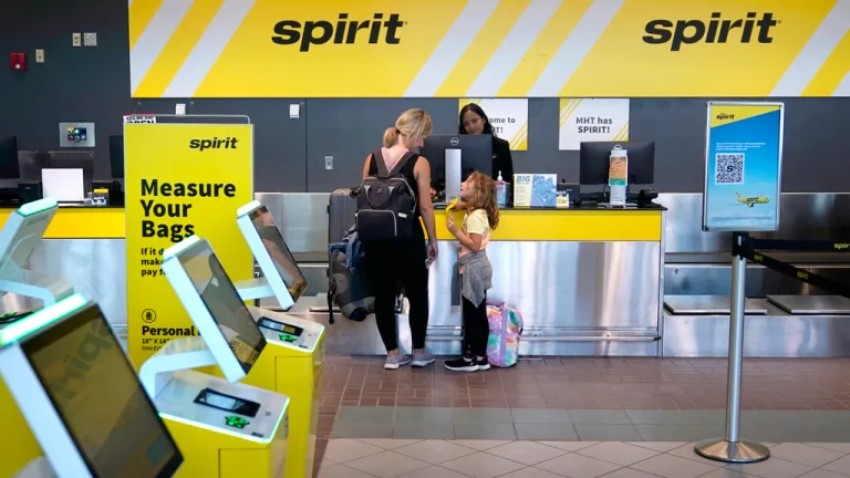Travelers check in at the Spirit Airlines ticket counter at Manchester Boston Regional Airport, Friday, June 2, 2023, in Manchester, N.H. (AP Photo/Charles Krupa)