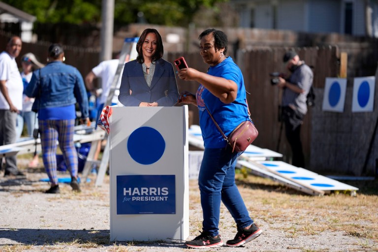 Arlett Brooks takes a selfie with a cutout of Democratic presidential nominee Vice President Kamala Harris in Omaha, Nebraska.