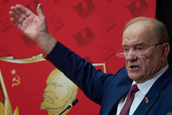 Zyuganov speaks in front of an image of Lenin
