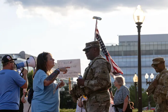 A protester confronts a member of the DC National Guard at Union Station, Monday, Sept. 1, 2025, in Washington.