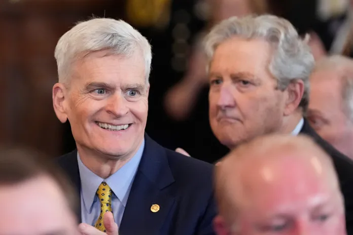 Sen. Bill Cassidy, R-La., and Sen. John Kennedy, R-La., right, arrive before President Donald Trump speaks during an event to welcome the 2025 LSU and LSU-Shreveport national champion baseball teams in the East Room of the White House, Monday, Oct. 20, 2025, in Washington