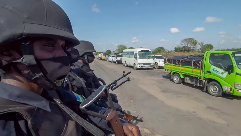 Rwandan police patrol a road in the Cabo Delgado province in Mozambique.