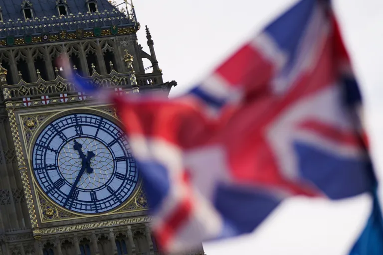 A British flag waves against the backdrop of the Elizabeth Tower