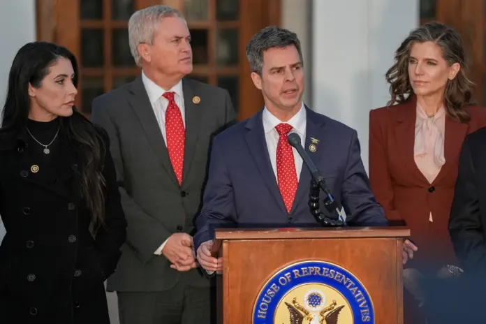 Rep. John McGuire, R-Va., speaks outside the Chappaqua Performing Arts Center where former President Bill Clinton was testifying before U.S. House lawmakers as part of a congressional investigation into convicted sex offender Jeffrey Epstein, Friday, Feb. 27, 2026, in Chappaqua, N.Y. (AP Photo/Angelina Katsanis)
