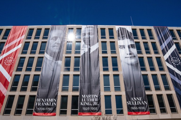 New banners of Benjamin Franklin, Martin Luther King Jr. and Anne Sullivan hang from the Department of Education, Sunday, March 1, 2026, in Washington. (AP Photo/Allison Robbert)