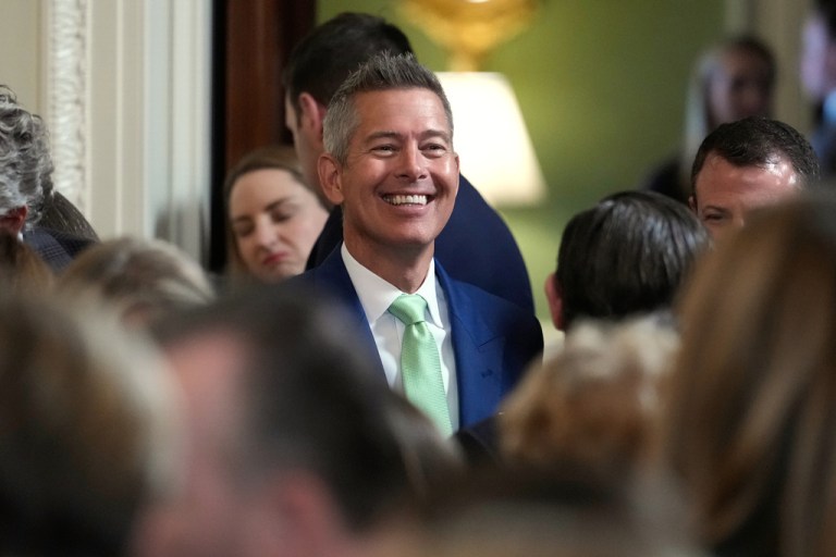 Transportation Secretary Sean Duffy arrives before Ireland's Prime Minister Micheál Martin presents President Donald Trump with a bowl of shamrocks during a St. Patrick's Day event in the East Room of the White House, Tuesday, March 17, 2026, in Washington. (AP Photo/Julia Demaree Nikhinson)