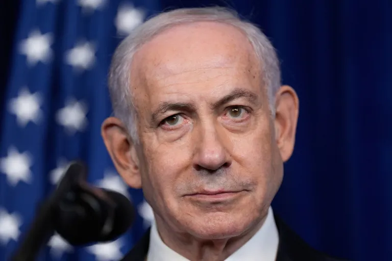 Israeli Prime Minister Benjamin Netanyahu listens during a December 2025 news conference with President Donald Trump.