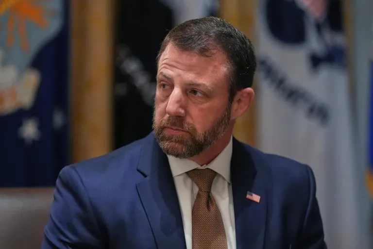 Homeland Security Secretary Markwayne Mullin listens during a Cabinet meeting at the White House, Thursday, March 26, 2026, in Washington. (AP Photo/Alex Brandon)