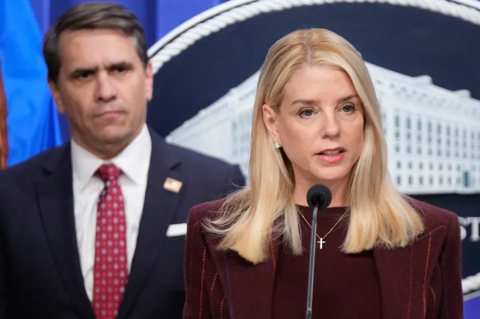Attorney General Pam Bondi speaks with reporters during a news conference at the Department of Justice, Nov. 19, 2025, in Washington, as Deputy Attorney General Todd Blanche, listens. (AP Photo/Mark Schiefelbein, file)
