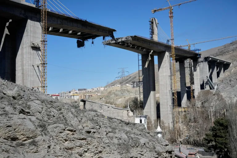 A newly constructed bridge struck by U.S. airstrikes Thursday is seen in Karaj, west of Tehran, Iran