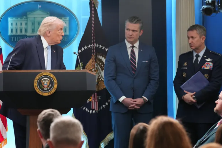 President Donald Trump looks to War Secretary Pete Hegseth and Chairman of the Joint Chiefs of Staff Gen. Dan Caine.