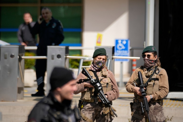 Turkish police and army secure the area after gunmen attacked at a building housing the Israeli Consulate in Istanbul, Turkey.