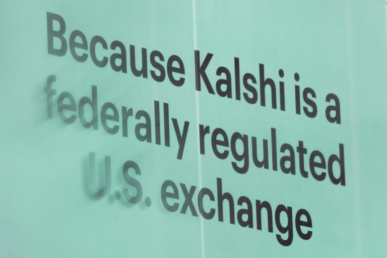 An advertisement for prediction market platform Kalshi hangs at 13th and L Street NW in Washington, Wednesday, April 1, 2026. (AP Photo/Allison Robbert)