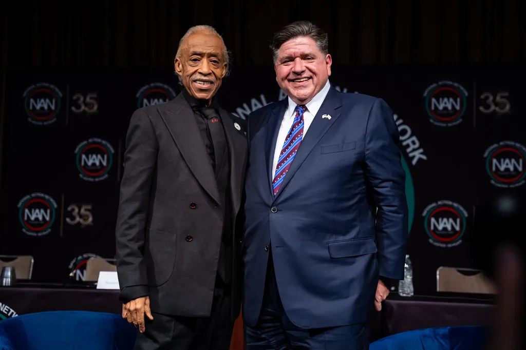 The Rev. Al Sharpton and Gov. JB Pritzker (D-IL) pose for a photo at the National Action Network Convention.