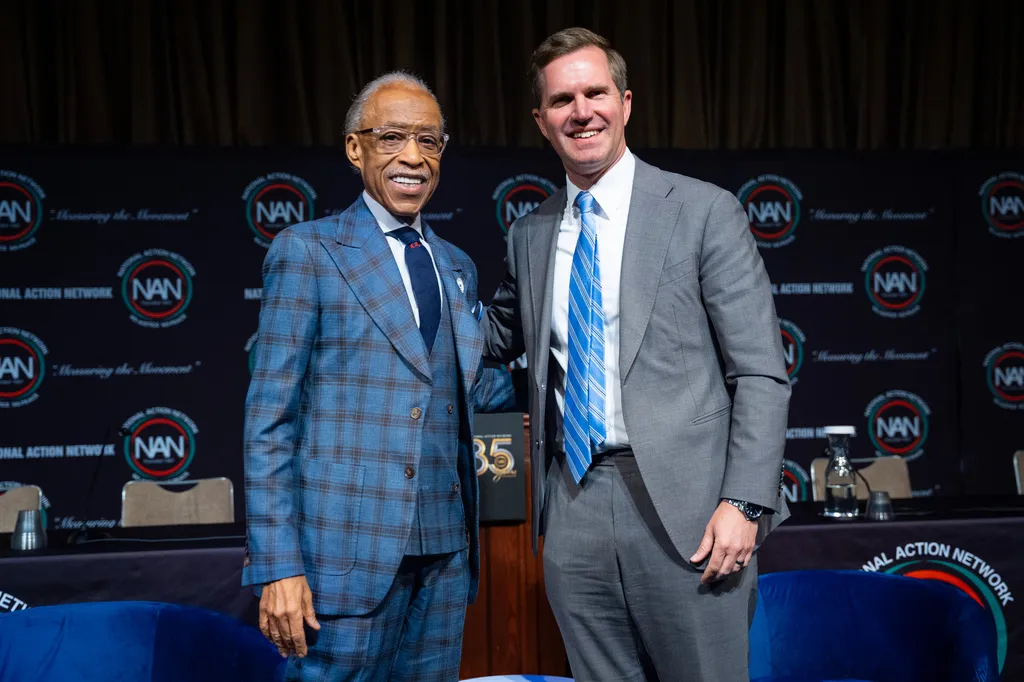 Gov. Andy Beshear (D-KY) poses with the Rev. Al Sharpton at the National Action Network Convention.