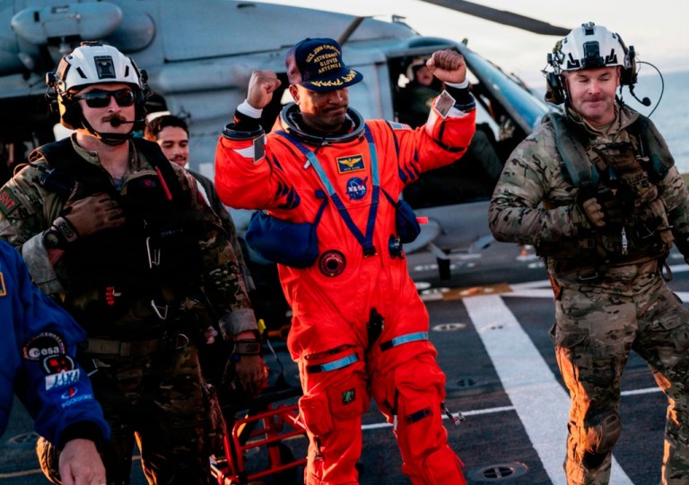 This photo provided by the U.S. Navy, NASA astronaut Victor Glover celebrates on the flight deck of the USS John P. Murtha (LPD 26) off the coast of California after returning from space on Friday, April 10, 2026.