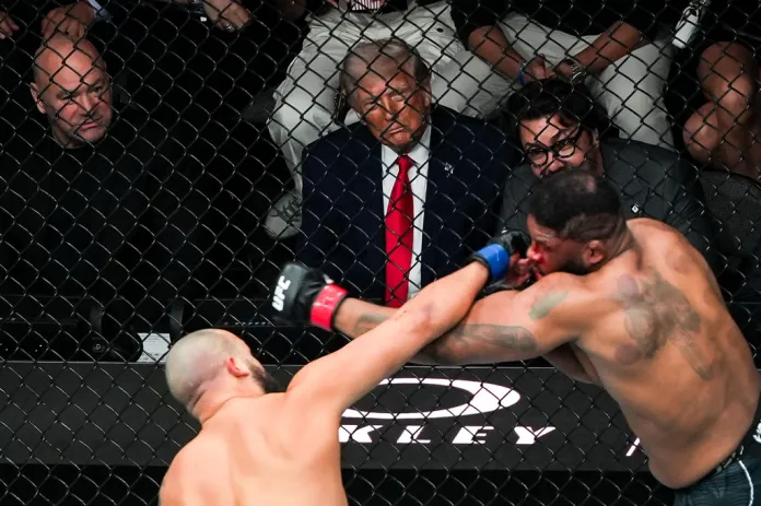 Dana White, President Donald Trump and Hunter Campbell attend UFC 327 at Kaseya Center, Saturday, April 11, 2026, in Miami. 