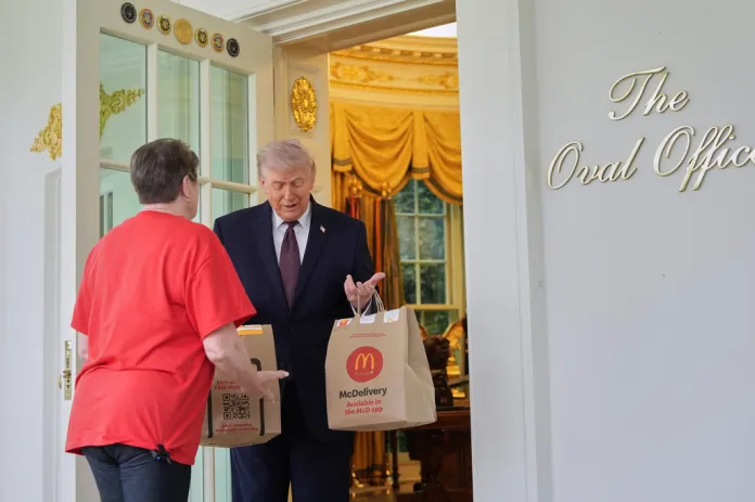 President Donald Trump speaks to a woman from Door Dash,