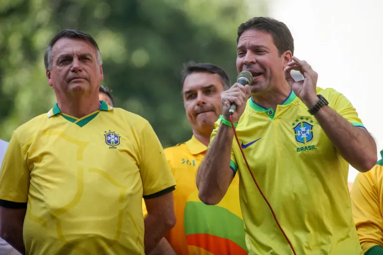 Alexandre Ramagem speaks as former Brazilian President Jair Bolsonaro looks on.