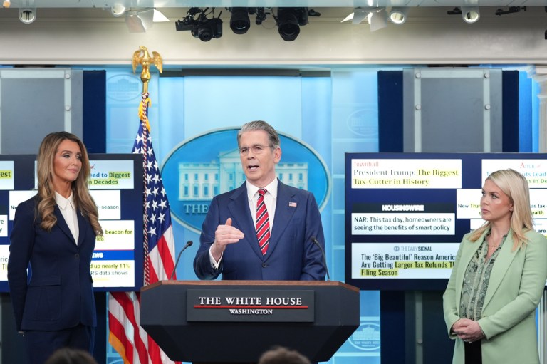 Treasury Secretary Scott Bessent speaks with reporters in the James Brady Press Briefing Room at the White House, Wednesday, April 15, 2026, in Washington, as Small Business Administration administrator Kelly Loeffler and White House press secretary Karoline Leavitt listen.
