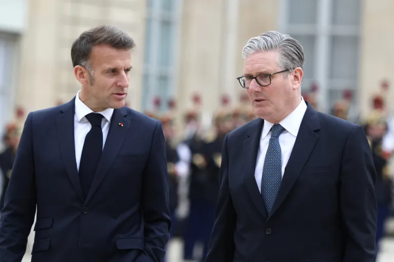 British Prime Minister Keir Starmer, right, and French President Emmanuel Macron leave after the multinational virtual summit and press conference at the Elysee Presidential Palace in Paris, Friday April 17, 2026