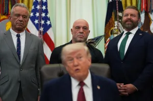 Trump signs order boosting psychedelic drugs for PTSD with Rogan looking on