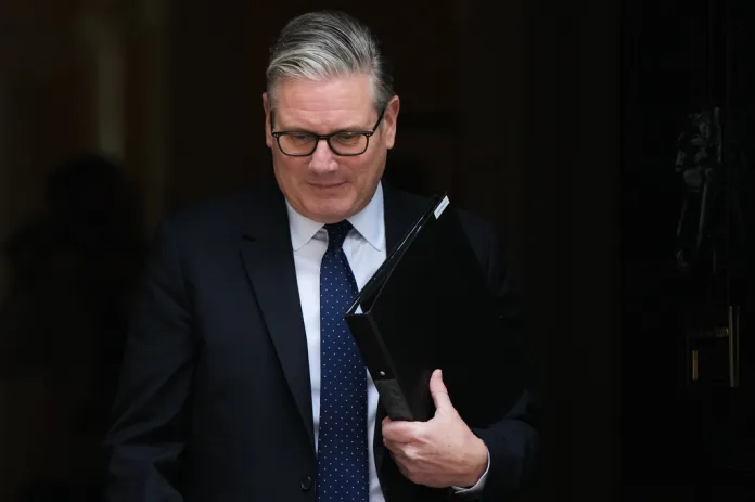 Keir Starmer carries his binder out of 10 Downing Street