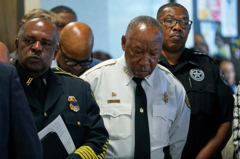 From left, Shreveport Police Chief Wayne Smith, Sheriff Henry Whitehorn, Marshal James Jefferson, listen during a news conference about the children killed during a mass shooting the day before in Shreveport, La., Monday, April 20, 2026.