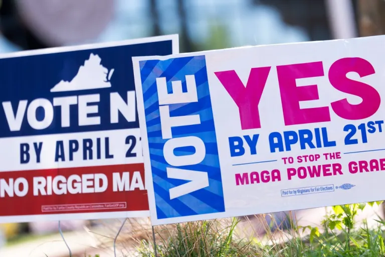 Signs are seen outside Fairfax Government Center during the Virginia redistricting referendum