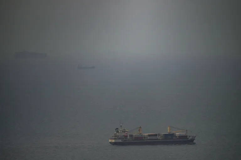 A cargo ship sails in the Persian Gulf toward the Strait of Hormuz, Wednesday, April 22, 2026.