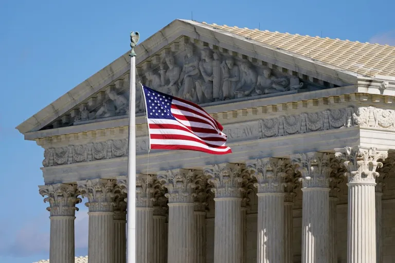 An American flag waves in front of the Supreme Court building on Capitol Hill in Washington, on Nov. 2, 2020. (AP Photo/Patrick Semansky, File)