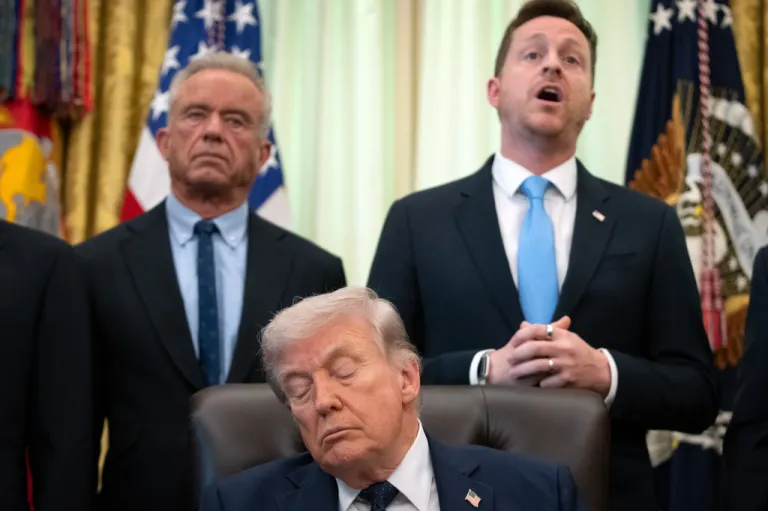 Chris Klomp, director of the Centers for Medicare and Medicaid Services, right, speaks as President Donald Trump and Health and Human Services Secretary Robert F. Kennedy Jr. listen as during an event on health care affordability in the Oval Office at the White House, Thursday, April 23, 2026, in Washington.