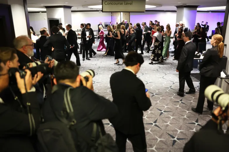 Guest evacuate after an incident at the White House Correspondents Dinner, Saturday, April 25, 2026, in Washington.